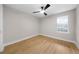 Bright bedroom with natural light, wood floors, and ceiling fan at 3066 Chastain Park Ne Ct, Atlanta, GA 30342