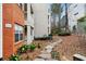 Exterior view of apartment building with walkway and landscaping at 3066 Chastain Park Ne Ct, Atlanta, GA 30342
