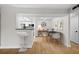 An inviting dining area connects the living space with a sleek, modern kitchen, creating seamless flow at 3066 Chastain Park Ne Ct, Atlanta, GA 30342