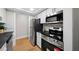 Modern kitchen featuring stainless steel appliances, white cabinets, and sleek black countertops at 3066 Chastain Park Ne Ct, Atlanta, GA 30342