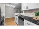 Kitchen view showcasing countertops, stainless steel sink and appliances, and white cabinets at 3066 Chastain Park Ne Ct, Atlanta, GA 30342