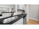 Kitchen sink and countertops with white cabinets and modern faucet at 3066 Chastain Park Ne Ct, Atlanta, GA 30342