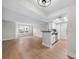 Open-concept living space with sleek kitchen and ample room for entertaining and modern living at 3066 Chastain Park Ne Ct, Atlanta, GA 30342