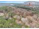 Overhead view of the home and property with a scenic mountain backdrop at 1514 Howell Highlands Dr, Stone Mountain, GA 30087