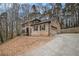 Charming two-story brick home featuring a large, attached two-car garage at 1514 Howell Highlands Dr, Stone Mountain, GA 30087