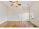 Hardwood floor bedroom with ceiling fan and large closet at 1720 Meadow Forest Lane, Duluth, GA 30097