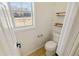 Small powder room with toilet and floating shelves at 1720 Meadow Forest Lane, Duluth, GA 30097