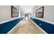 Elegant hallway with blue and white color scheme and framed artwork at 800 Peachtree Ne St # 8607, Atlanta, GA 30308