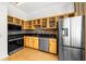 Modern kitchen with stainless steel appliances and light wood cabinets at 800 Peachtree Ne St # 8607, Atlanta, GA 30308