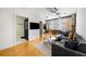 Open living area with hardwood floors, gray sectional sofa, and kitchen at 800 Peachtree Ne St # 8607, Atlanta, GA 30308