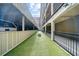 Secured parking area with a grassy walkway at 800 Peachtree Ne St # 8607, Atlanta, GA 30308