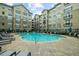 Community pool with plenty of lounge chairs at 800 Peachtree Ne St # 8607, Atlanta, GA 30308