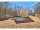 House exterior showcasing a sunroom and expansive backyard at 304 Stations Ave, Woodstock, GA 30189