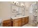 Double vanity bathroom with a large mirror and updated finishes at 304 Stations Ave, Woodstock, GA 30189