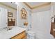 Bathroom with a shower/tub combo, wood vanity, and neutral tones at 304 Stations Ave, Woodstock, GA 30189