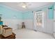 Light and airy bedroom with light blue walls and white trim at 304 Stations Ave, Woodstock, GA 30189