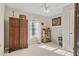 Charming bedroom with hardwood floors, a ceiling fan and window at 304 Stations Ave, Woodstock, GA 30189