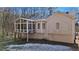 Rear view of house, highlighting the sunroom and landscaping at 304 Stations Ave, Woodstock, GA 30189