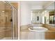 Bathroom with walk-in shower and corner soaking tub at 325 E Paces Ferry Ne Rd # 1608, Atlanta, GA 30305