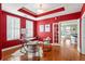 Stylish home office with red walls and hardwood floors at 325 E Paces Ferry Ne Rd # 1608, Atlanta, GA 30305