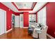 Bright sitting room with comfy seating and red walls at 325 E Paces Ferry Ne Rd # 1608, Atlanta, GA 30305