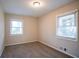 Bright bedroom with neutral walls and carpet, featuring two large windows at 3854 Brookcrest Cir, Decatur, GA 30032