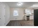 Bright dining area with hardwood floors and a view of the kitchen at 3854 Brookcrest Cir, Decatur, GA 30032