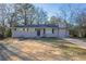 Newly renovated ranch home with stone accents and a well-manicured lawn at 3854 Brookcrest Cir, Decatur, GA 30032