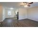 Open living room with hardwood floors and a view of the kitchen and dining area at 3854 Brookcrest Cir, Decatur, GA 30032