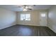 Living room with hardwood floors, ceiling fan and access to the front door at 3854 Brookcrest Cir, Decatur, GA 30032