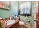 Clean bathroom with single sink vanity and shower/tub combo at 434 Cana Of Galilee Ct, Tucker, GA 30084