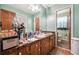 Bathroom with wood cabinets, double vanity, and tile flooring at 434 Cana Of Galilee Ct, Tucker, GA 30084