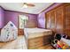 Bedroom with purple walls, double closet, and tile floor at 434 Cana Of Galilee Ct, Tucker, GA 30084