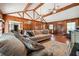 Living area showcasing hardwood floors, wood paneling, and a comfortable sofa at 434 Cana Of Galilee Ct, Tucker, GA 30084