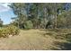 Large side yard with mature trees and shed at 434 Cana Of Galilee Ct, Tucker, GA 30084