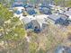 Aerial view showing a townhouse community nestled among trees at 6034 Regent Mnr, Lithonia, GA 30058