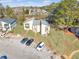 Aerial view of townhouses with ample parking and landscaping at 6034 Regent Mnr, Lithonia, GA 30058