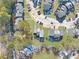 Wide aerial view of a neighborhood with townhouses and roads at 6034 Regent Mnr, Lithonia, GA 30058