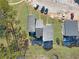 Overhead view of townhouses with driveways and surrounding green space at 6034 Regent Mnr, Lithonia, GA 30058