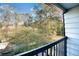 Balcony view overlooking a wooded area at 6034 Regent Mnr, Lithonia, GA 30058