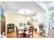 Bright dining area with a glass-top table and four chairs at 6034 Regent Mnr, Lithonia, GA 30058