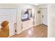 Entryway with wood floors and view into the kitchen at 6034 Regent Mnr, Lithonia, GA 30058