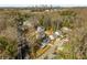 Aerial shot of a neighborhood with mature trees and an Atlanta skyline in the background at 1399 Knob Hill Se Ct, Atlanta, GA 30316