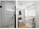 Updated bathroom featuring a walk-in shower, free standing tub, and open view to the main bedroom at 1399 Knob Hill Se Ct, Atlanta, GA 30316