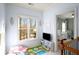 Inviting area with a large window, TV, view to Bedroom and play area at 1399 Knob Hill Se Ct, Atlanta, GA 30316