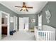 Neutral Bedroom with crib, and access to hall bathroom at 1399 Knob Hill Se Ct, Atlanta, GA 30316