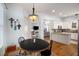Bright breakfast nook leading into a modern kitchen with a view into the living room at 1399 Knob Hill Se Ct, Atlanta, GA 30316