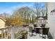 Private deck with snow-covered patio furniture and wooded views at 1399 Knob Hill Se Ct, Atlanta, GA 30316