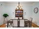 Elegant dining room features a large table, hutch, and hardwood floors at 1399 Knob Hill Se Ct, Atlanta, GA 30316