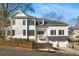 White two-story house with black shutters, a two-car garage, and a fenced yard at 1399 Knob Hill Se Ct, Atlanta, GA 30316